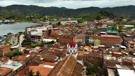 Aerial-view-over-the-Guatape-Town,-cloudy-day-in-Antioquia,-Colombia