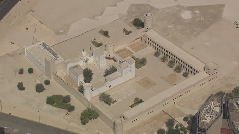 Establishing-zoom-out-shot-of-the-Qasr-AlHosn-in-downtown-Abu-Dhabi,-UAE