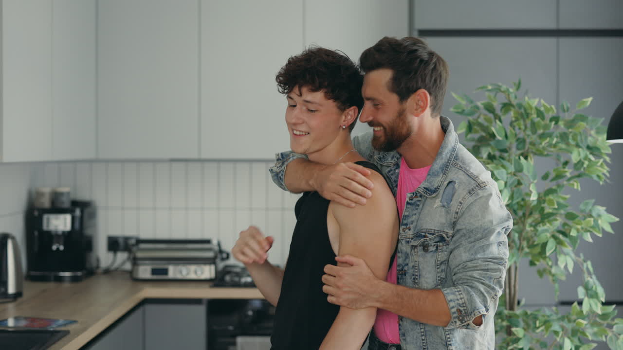 Happy Gay Couple in a Modern Kitchen