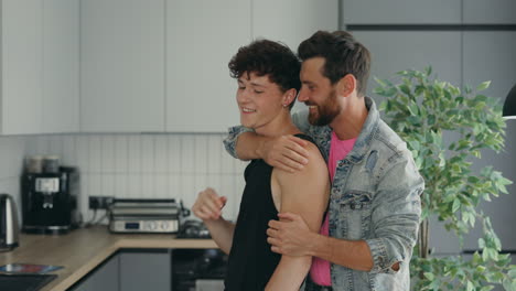 happy gay couple in a modern kitchen