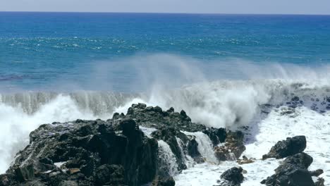 powerful ocean waves crashing on rocks