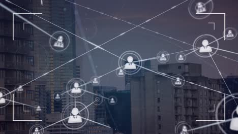 animation of connected icons and viewfinder over modern buildings against sky