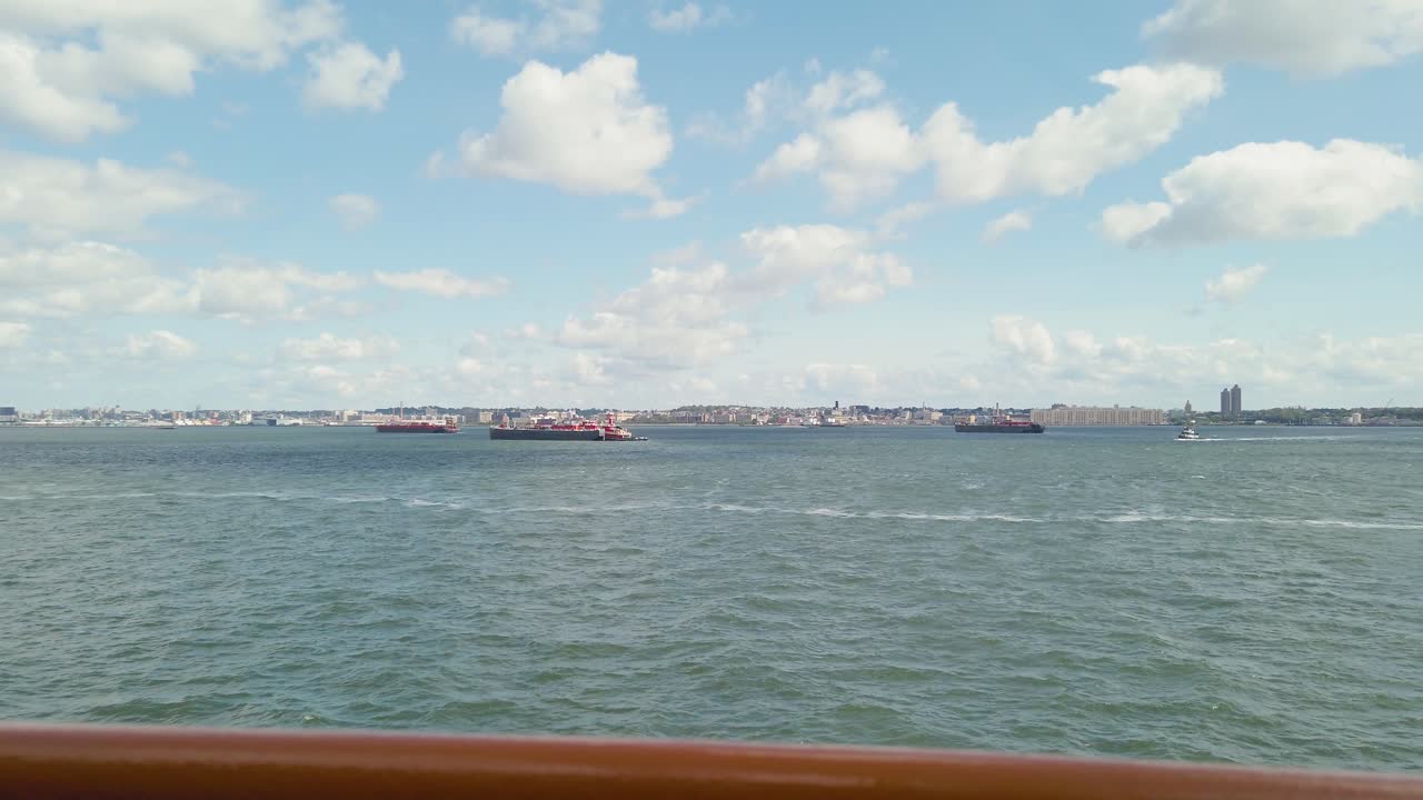 View from inside ferry to New York City and Liberty Statue. Travelling by boat