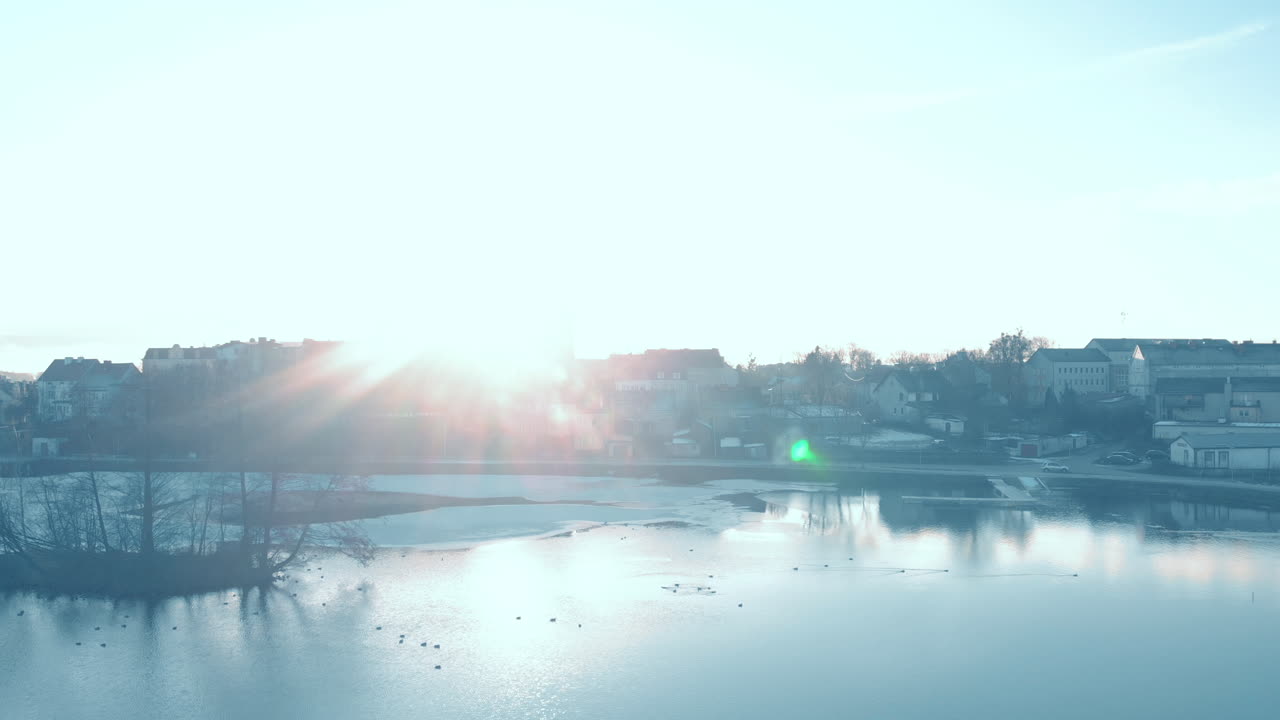 Calm water and clear sky with smal clouds and big sun reflections, Quiet flight over Pond Garncarski - Gorowo ilweckie,