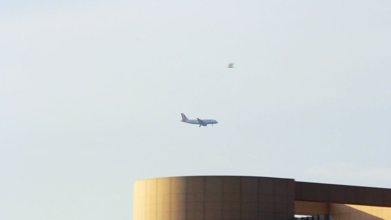 Plane flying over city. Passenger airplane flying. Aircraft fly over city