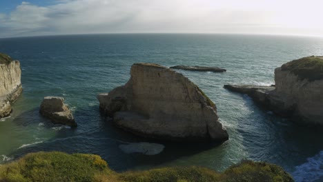 pov walking towards cliff edge overlooking shark fin cove, north of santa cruz