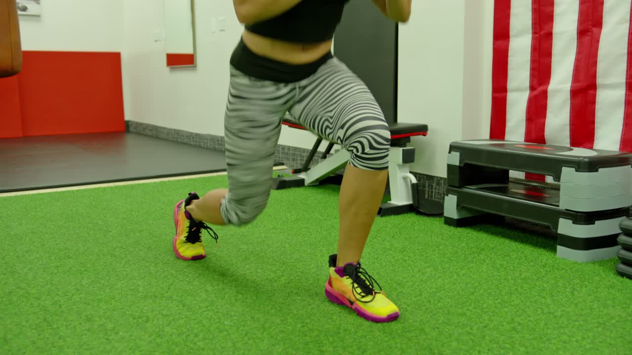 Active motivated female athlete training in gym