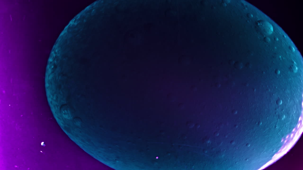 Colorful liquid mixing in vibrant macro close-up, creating abstract patterns with smooth motion