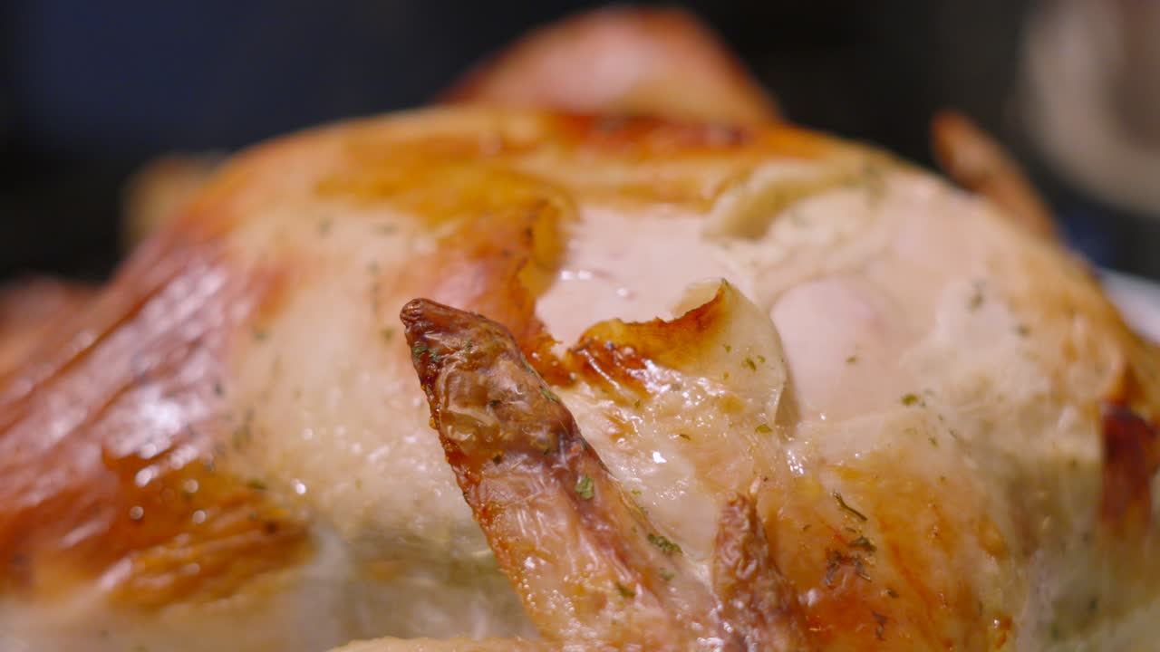 Delicious Fresh Roast Chicken with Crispy Skin with Wings with Steam Rising in Background. Ready to Eat Food Out of the Oven to Feed Family. Traditional British Sunday Dinner Feast 4K.