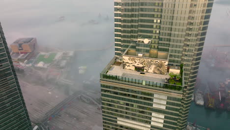 Aerial-tilt-down-shot-of-W-Hotel-Hong-Kong-in-West-Kowloon-District,Hong-Kong-on-a-cold-day