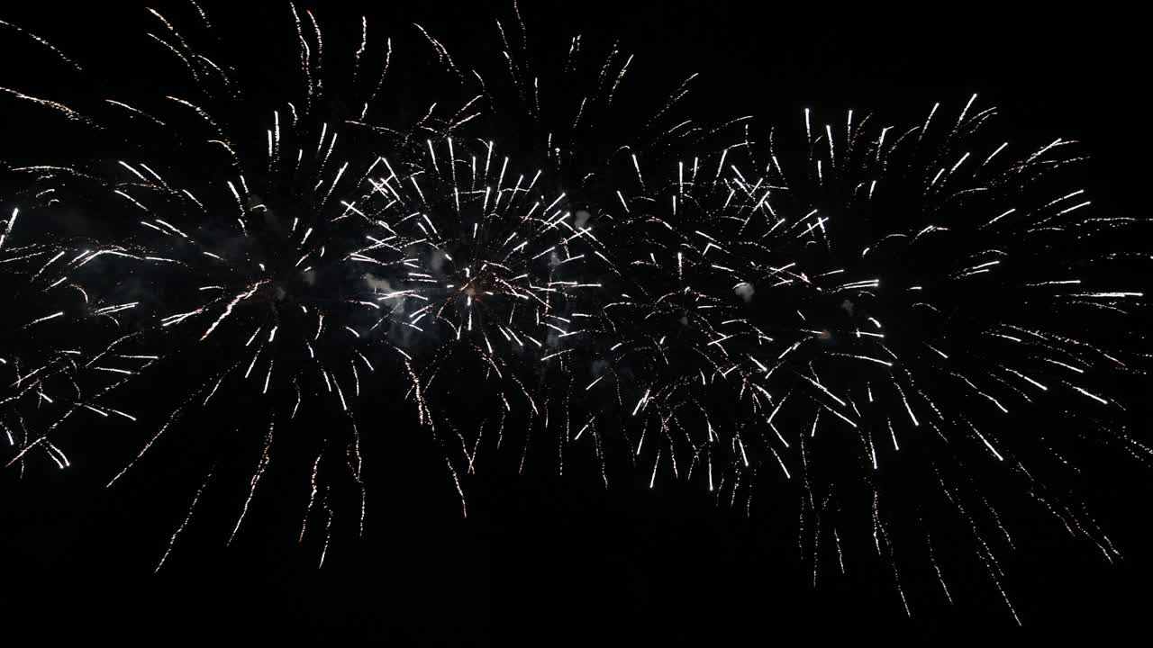 4K long time seamless loop of real colourful fireworks festival in sky display at night during national holiday, new year party 2022