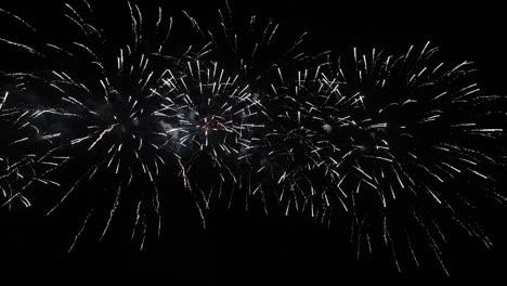 4k long time seamless loop of real colourful fireworks festival in sky display at night during national holiday, new year party 2022