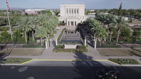 aerial shot of car driving by mormon temple in mesa, arizona