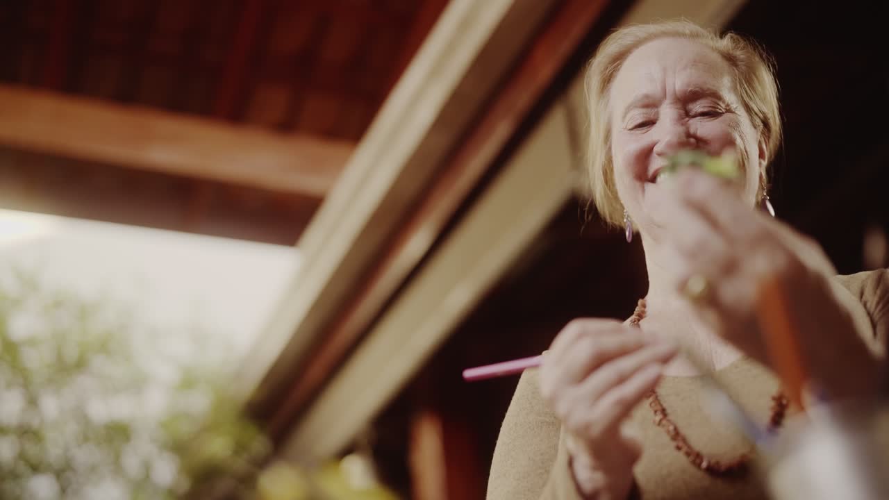 Smiling Elderly Woman in a Relaxed Outdoor Setting