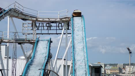 people enjoying a log flume ride