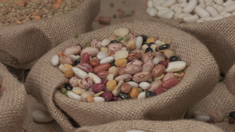 dry legumes beans falling on jute bowl