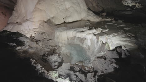 cave exploration with water pool