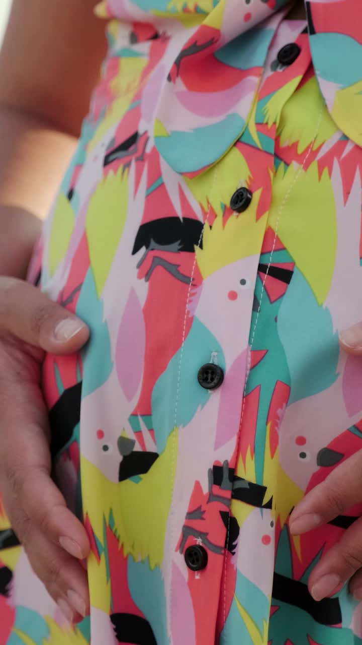 Woman in colorful shirt and straw hat