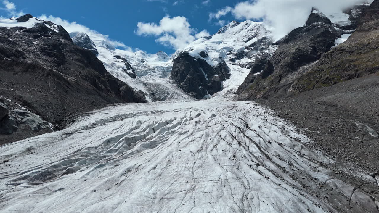 Majestic Morteratsch Glacier under blue sky viewed in full daylight