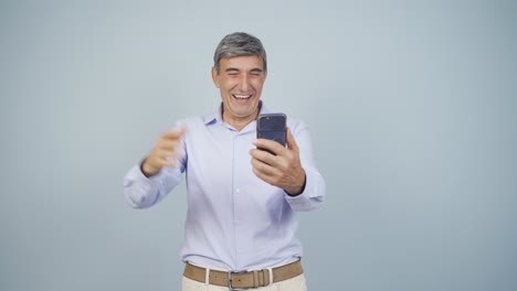 Old-man-making-a-video-call-on-the-phone.