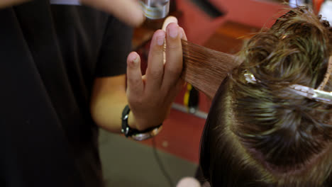 man getting his hair trimmed with scissor 4k