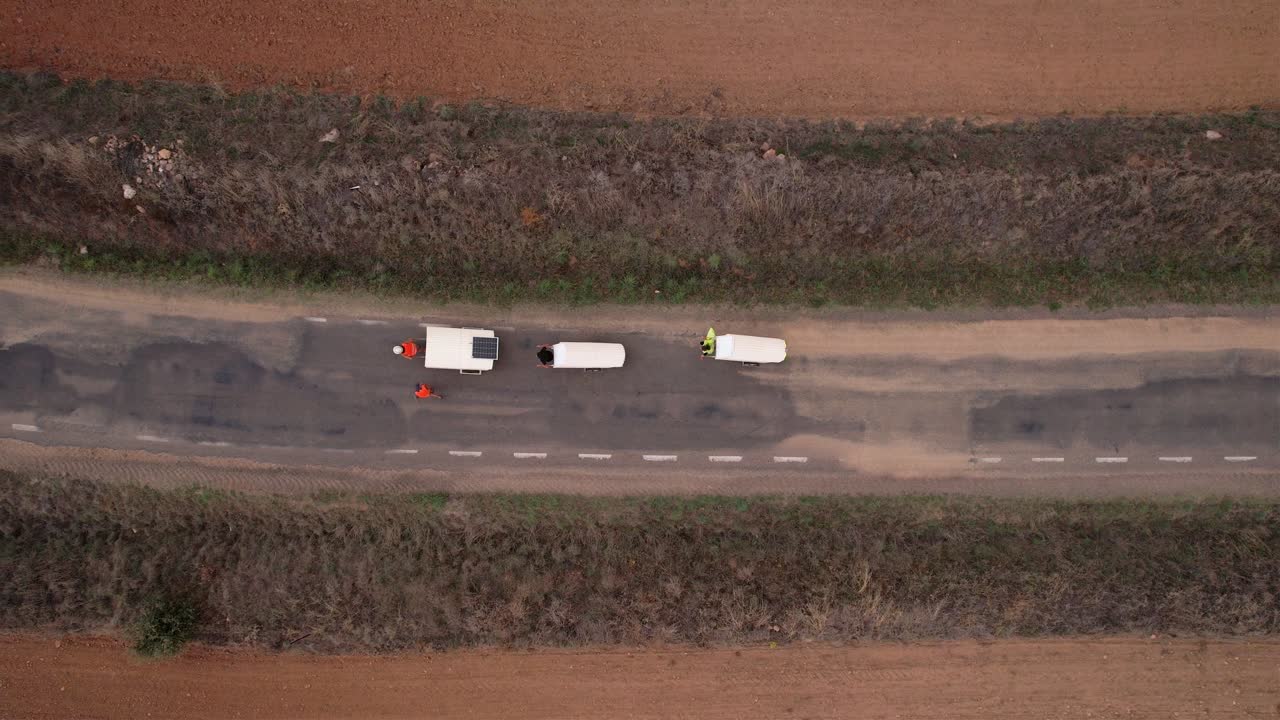 Nomad family pulling small homes on wheels in countryside in Spain