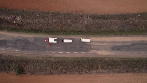 nomad family pulling small homes on wheels in countryside in spain