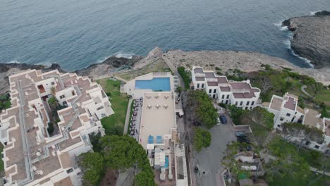 aereal over touristic houses and settlement near the coastline, captured during daytime at mallorca, spain