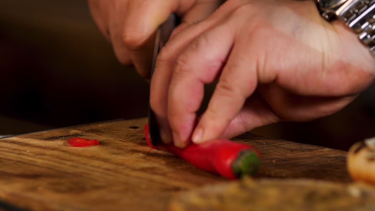 Chef Chopping Red Chili Peppers