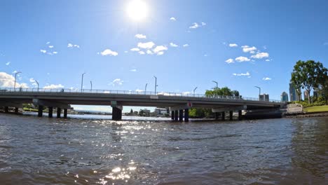 boat passing under a bridge in gold coast