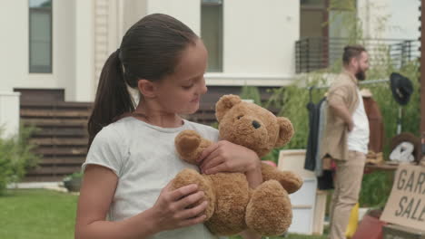 portrait of cute girl with plush bear