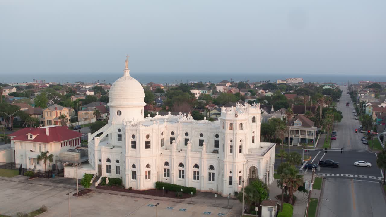 Drone view of Sacred Heart Catholic Church and surrounding area in Galveston, Texas