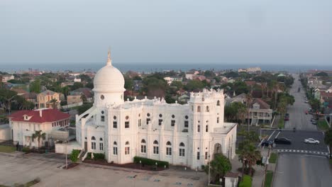 Drone-view-of-Sacred-Heart-Catholic-Church-and-surrounding-area-in-Galveston,-Texas