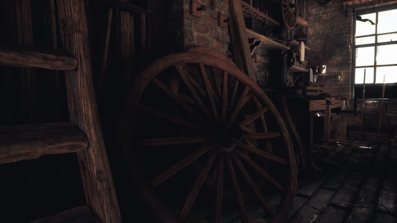 Old wooden wheel in a rustic workshop with tools and dim lighting