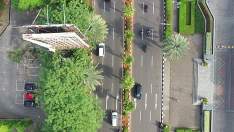 aerial view of a busy city street with traffic and urban landscape