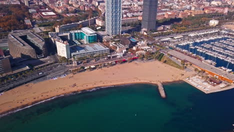 stunning drone shot of barceloneta beach in barcelona, spain