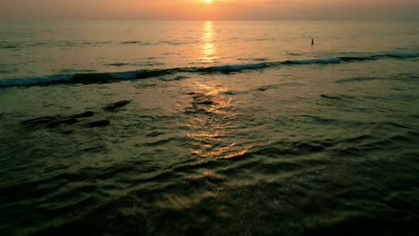 4K-Cinematic-nature-drone-footage-of-a-panoramic-aerial-view-of-the-beautiful-beaches-and-mountains-on-the-island-of-Koh-Lanta-in-Krabi,-South-Thailand,-during-sunset