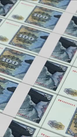 vertical video of 100 deutsche mark germany banknotes printing by a money press