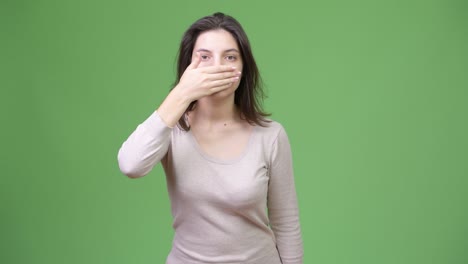 young beautiful woman covering mouth as three wise monkeys concept