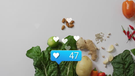 social media likes animation over fresh vegetables and nuts on white background