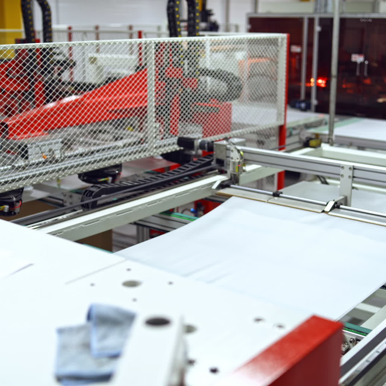 Solar panel is moving on a conveyor belt. Automated machine for producing solar cells inside the modern factory.