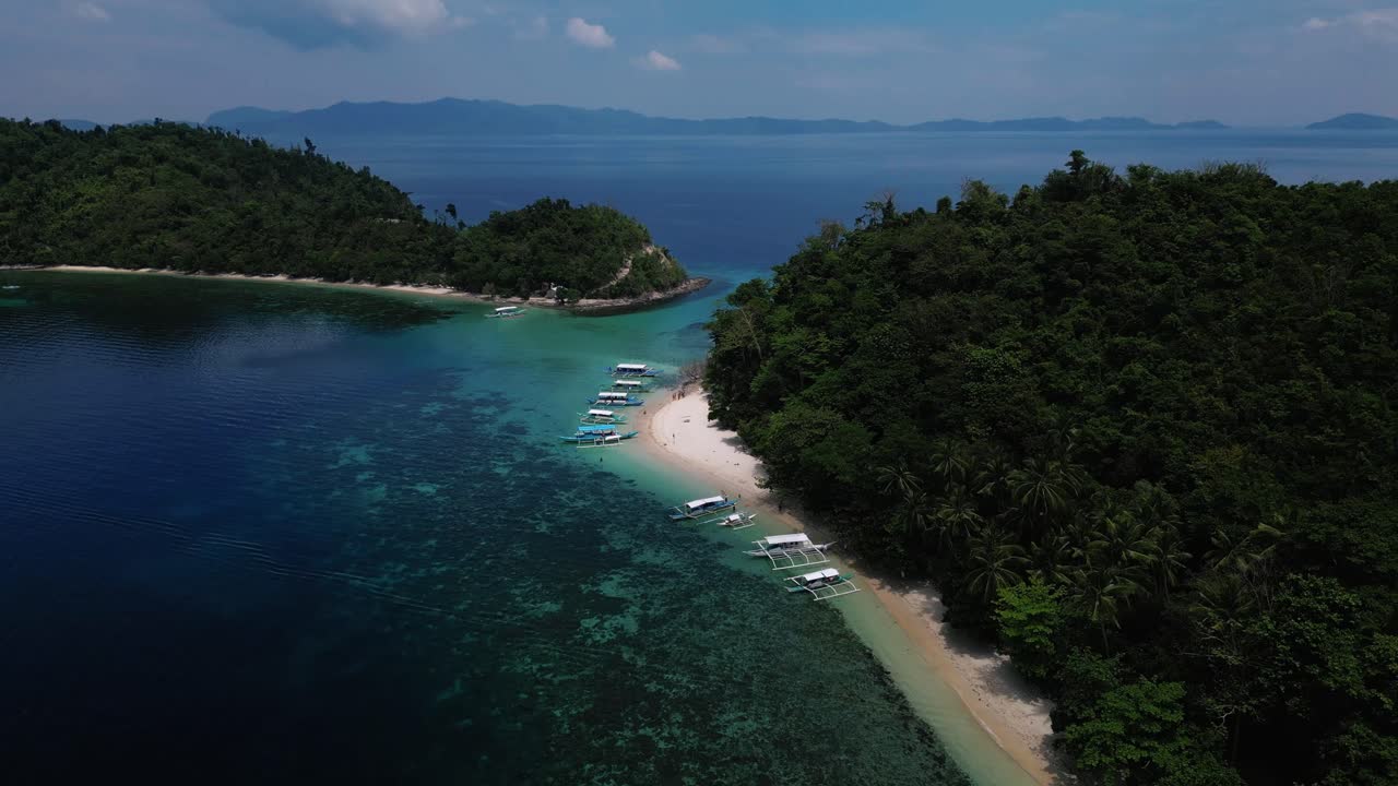 Pull back drone shot of Exotic Island in Palawan, Phillippines during dusk.