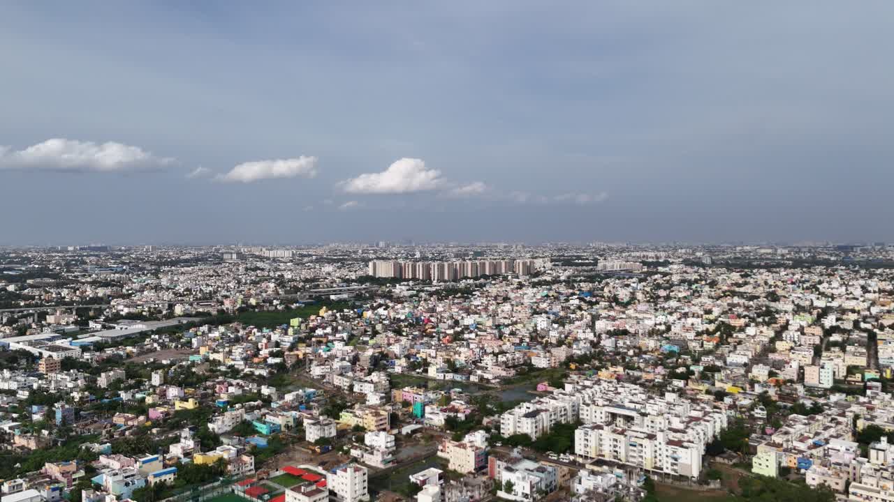 Sweeping drone footage of contemporary high-rise apartment towers and new urban infrastructure. Perfect for themes of city growth, investment, and modern living