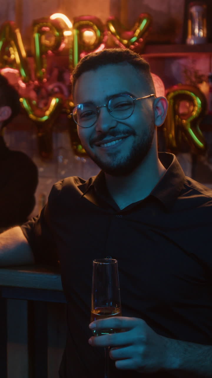 Man celebrating with champagne in a bar