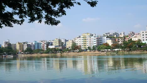 cityscape reflecting on a lake