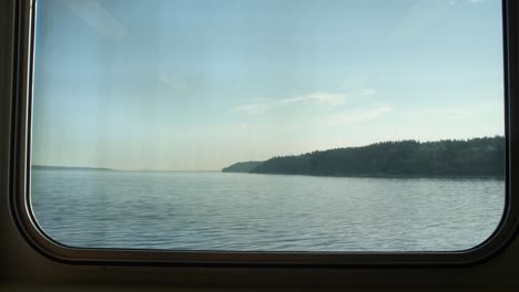 view of the puget sound looking out from a ferry window