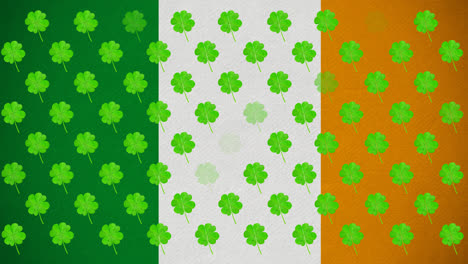 Animación-Digital-De-Múltiples-Hojas-De-Trébol-Flotando-Contra-La-Bandera-Irlandesa