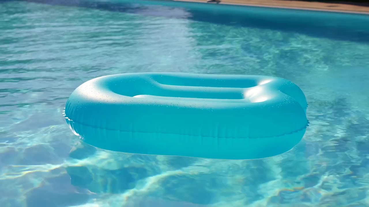 an inflatable ring floats leisurely in a swimming pool, captured from a top-down perspective, showcasing a relaxed and fun summer activity with a clean, natural setting and vibrant blue.