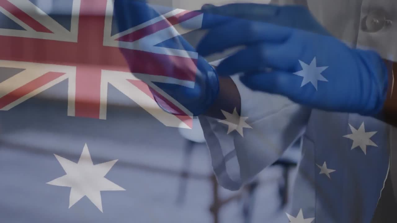 뉴질랜드  ⁇ 발을 포기하는 것을 반대하는 수술 장갑을 입은 남성 의사의 중간 섹션