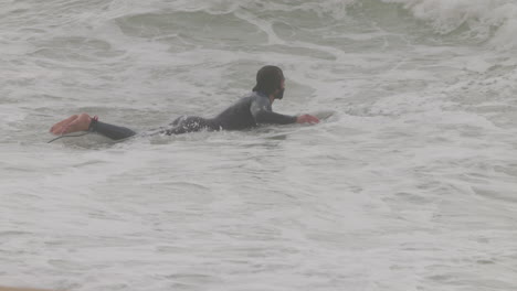 male surfer riding a wave